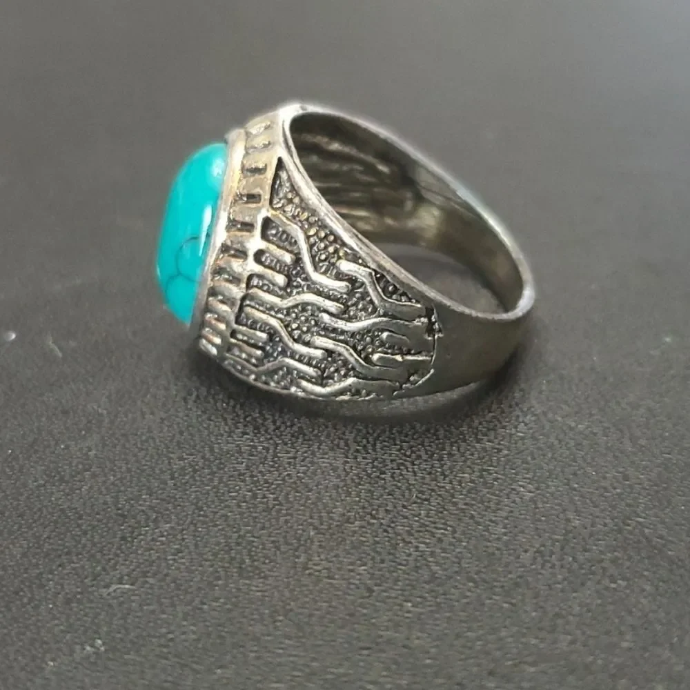 Silver tone ring with blue size 10.25